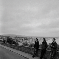 Jesse Rómlárson, Nevan Lochlann and Eoin Belfield overlooking Bray Bay in Dublin during the early years of Eventstellar in 2016