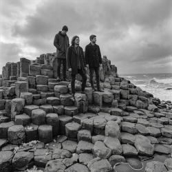 Jesse Rómlárson, Eoin Belfield and Nevan Lochlann at Giant's Causeway in Northern Ireland during the early years of Eventstellar in 2016