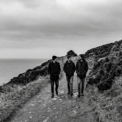 The members of Sojourner walking along the coastal path in Howth north of Dublin overlooking the Irish Sea