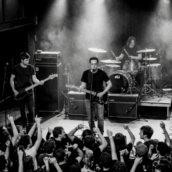 Sojourner performing before a packed audience during one of the band's final Mexican shows in 2015