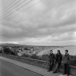 Jesse Rómlárson, Nevan Lochlann and Eoin Belfield overlooking Bray Bay in Dublin during the early years of Eventstellar in 2016