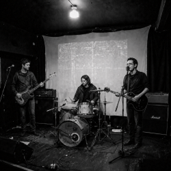 Nevan Lochlann, Eoin Belfield and Jesse Rómlárson performing during an early live session in Bray